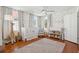 Charming Bedroom with stylish decor, including a crib, giraffe toy, and patterned wallpaper at 100 Queen St, Charleston, SC 29401