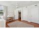 Well-lit bedroom featuring hardwood floors, patterned wallpaper, and decorative accents at 100 Queen St, Charleston, SC 29401