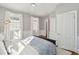 Comfortable bedroom filled with natural light from two windows and neutral decor at 100 Queen St, Charleston, SC 29401
