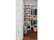 Organized closet with shelving, baskets, and hanging storage for clothes and accessories at 100 Queen St, Charleston, SC 29401