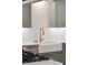 Close-up on kitchen sink with white subway tile backsplash and stainless steel appliances at 100 Queen St, Charleston, SC 29401