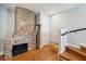 Inviting living space with exposed brick, hardwood floors, and staircase at 100 Queen St, Charleston, SC 29401