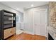 Bright home office with a fireplace, built-in shelving, and a cozy work area at 100 Queen St, Charleston, SC 29401