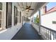 Inviting porch with classic columns and black shutters offering a relaxing outdoor space at 100 Queen St, Charleston, SC 29401