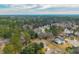 Expansive aerial image featuring a mix of homes and dense woodland areas at 105 New Ct, Summerville, SC 29483