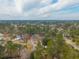 An aerial shot showcasing a neighborhood nestled within a dense forest at 105 New Ct, Summerville, SC 29483