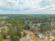 Wide aerial view showcasing the home's location in a wooded neighborhood at 105 New Ct, Summerville, SC 29483