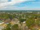 Scenic aerial perspective of homes intertwined within a vast woodland at 105 New Ct, Summerville, SC 29483