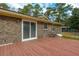 Spacious outdoor deck with access to the home and view of the backyard at 105 New Ct, Summerville, SC 29483