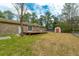 Expansive backyard with well-maintained lawn and a storage shed at 105 New Ct, Summerville, SC 29483
