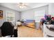 Sunlit bedroom featuring updated ceiling fan, wood floors, and large window at 105 New Ct, Summerville, SC 29483