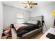 Neutral bedroom features an upholstered headboard, ceiling fan and ample natural light at 105 New Ct, Summerville, SC 29483