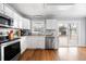 Bright kitchen featuring white cabinets, stainless steel appliances, and hardwood floors at 105 New Ct, Summerville, SC 29483