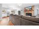 Open concept living room and kitchen with hardwood floors and bright windows at 105 New Ct, Summerville, SC 29483