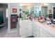 Bathroom featuring a large mirror, white cabinets, and white tile floors at 106 Caveson Dr, Summerville, SC 29483