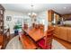 Classic dining room featuring a wooden table and view into the kitchen at 106 Caveson Dr, Summerville, SC 29483