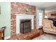 Living room close up of the fireplace that features a brick hearth and white mantle at 106 Caveson Dr, Summerville, SC 29483