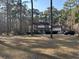 Charming two-story home with inviting front porch, surrounded by mature trees offering shade and privacy at 106 Caveson Dr, Summerville, SC 29483