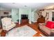 Inviting living room with hardwood floors, cozy seating, and a staircase with wooden banister at 106 Caveson Dr, Summerville, SC 29483