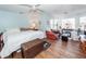 Spacious main bedroom featuring hardwood floors, bay windows, ceiling fan and soft blue walls at 106 Caveson Dr, Summerville, SC 29483