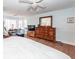 Light-filled main bedroom with hardwood flooring, bay window, and modern ceiling fan at 106 Caveson Dr, Summerville, SC 29483