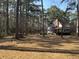 Beautifully landscaped yard surrounds this two-story home with white-trimmed windows and porch at 106 Caveson Dr, Summerville, SC 29483