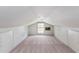 Finished attic featuring neutral carpet, windows for natural light, and access to additional storage at 108 Nightingale Manor, North Charleston, SC 29418