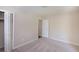 Bright bedroom featuring neutral walls, plush carpeting, and a closet for ample storage at 108 Nightingale Manor, North Charleston, SC 29418