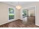 Bright dining room featuring a stylish chandelier and wood-look floors, creating an inviting atmosphere at 108 Nightingale Manor, North Charleston, SC 29418