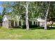 Lovely brick house with green lawn, accented by mature trees and a double garage, nestled in a serene neighborhood at 108 Nightingale Manor, North Charleston, SC 29418
