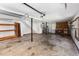 Spacious garage featuring concrete floors, garage door openers and wood trim at 108 Nightingale Manor, North Charleston, SC 29418