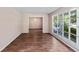Bright living room with wood-look floors and large window offering a scenic view at 108 Nightingale Manor, North Charleston, SC 29418