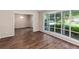Bright living room with wood-look floors and large window offering an outdoor view at 108 Nightingale Manor, North Charleston, SC 29418