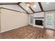 Living room with wood flooring, fireplace, a door to outside, and beamed ceilings at 108 Nightingale Manor, North Charleston, SC 29418