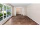 Bright living room featuring a large bay window and wood-look floors creating a welcoming space at 108 Nightingale Manor, North Charleston, SC 29418