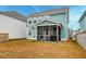 View of the home's screened-in porch and ample backyard space at 109 Forest Springs Rd, Moncks Corner, SC 29461