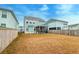 Spacious backyard with lawn and screened-in patio, perfect for outdoor entertaining at 109 Forest Springs Rd, Moncks Corner, SC 29461