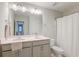 Clean bathroom offers double sinks, white countertops, and a shower-tub combination, for a practical design at 109 Forest Springs Rd, Moncks Corner, SC 29461