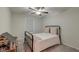 Cozy bedroom with soft carpet, a charming metal frame bed, and a ceiling fan, perfect for relaxation at 109 Forest Springs Rd, Moncks Corner, SC 29461