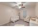 Charming Bedroom featuring soft pink walls, a white crib, and a cozy chair, perfect for a new baby at 109 Forest Springs Rd, Moncks Corner, SC 29461