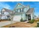 Charming two-story home with attached garage, manicured lawn, and welcoming entryway at 109 Forest Springs Rd, Moncks Corner, SC 29461