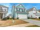 Front exterior featuring a two-story house with a driveway and landscaping, inviting curb appeal at 109 Forest Springs Rd, Moncks Corner, SC 29461