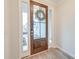 Inviting entryway featuring a wood door with glass panels and sidelights, creating a warm welcome at 109 Forest Springs Rd, Moncks Corner, SC 29461