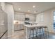 Bright kitchen with stainless steel appliances, kitchen island, and gray cabinets at 109 Forest Springs Rd, Moncks Corner, SC 29461