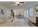 Open living room view showcasing the kitchen and its island with bar stool seating at 109 Forest Springs Rd, Moncks Corner, SC 29461