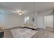 Bright living room features gray flooring, a ceiling fan, and a comfortable beige couch at 109 Forest Springs Rd, Moncks Corner, SC 29461