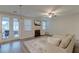 Cozy living room with fireplace, mounted TV, neutral sectional, and access to a patio at 109 Forest Springs Rd, Moncks Corner, SC 29461