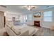 Open living room with fireplace, kitchen access, and backyard view from doors at 109 Forest Springs Rd, Moncks Corner, SC 29461