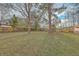 This is a large backyard with mature trees and a well kept lawn at 111 Summit Ave, Goose Creek, SC 29445