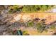 Aerial view of property showcasing cleared land and wooded trees at 117 Roberts Rd, Summerville, SC 29483